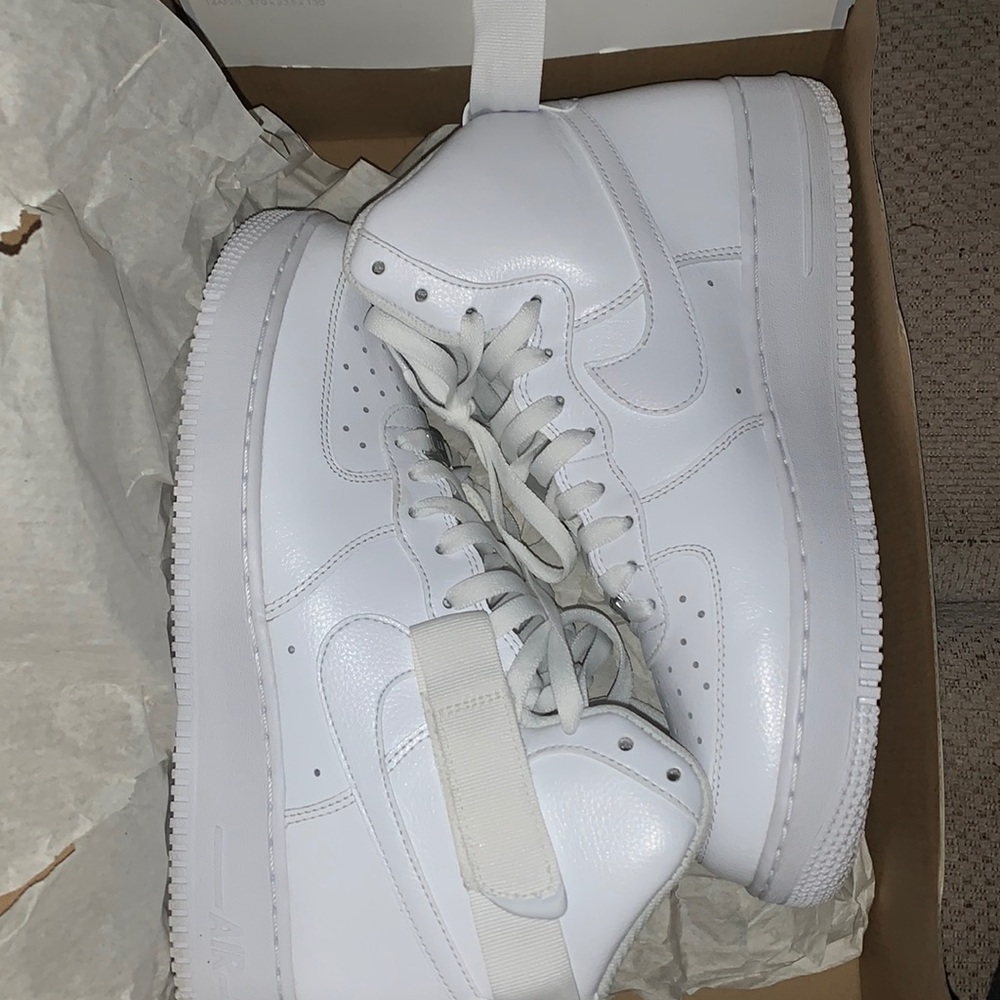All white Air Force 1’s high tops